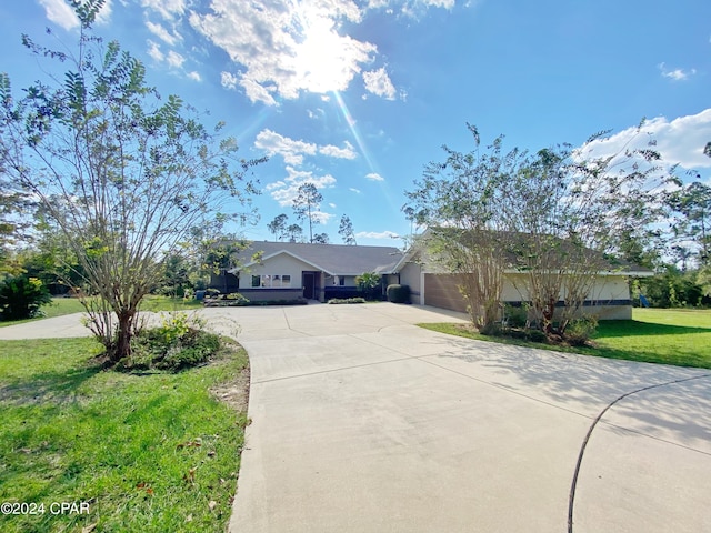 single story home featuring a front yard