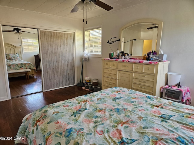 bedroom with multiple windows, ceiling fan, dark wood-type flooring, and ornamental molding