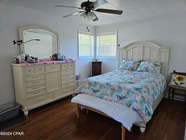 bedroom featuring ceiling fan and dark hardwood / wood-style floors