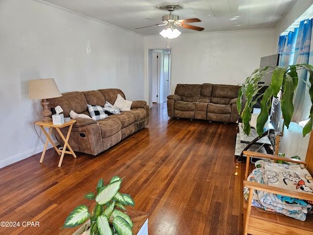 living room featuring dark hardwood / wood-style floors and ceiling fan