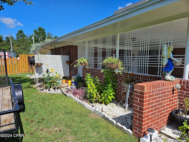 view of side of home featuring a yard