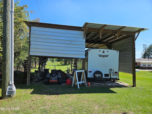 view of vehicle parking featuring a yard and a carport