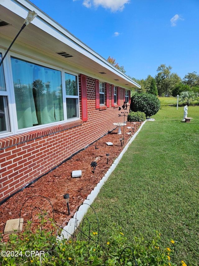 view of property exterior featuring a yard