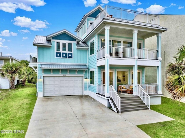 18916 Front Beach Rd, Panama City Beach, FL 32413 - view of front of house with board and batten siding, covered porch, a front yard, and a balcony