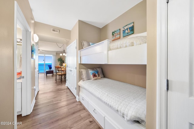 bedroom featuring visible vents and light wood-style flooring