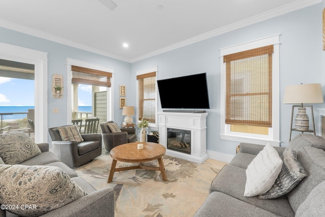 living room featuring a water view and ornamental molding