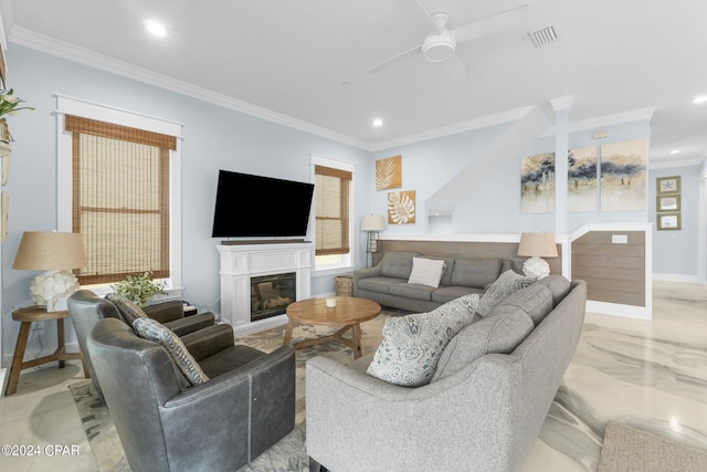 living room with crown molding and ceiling fan