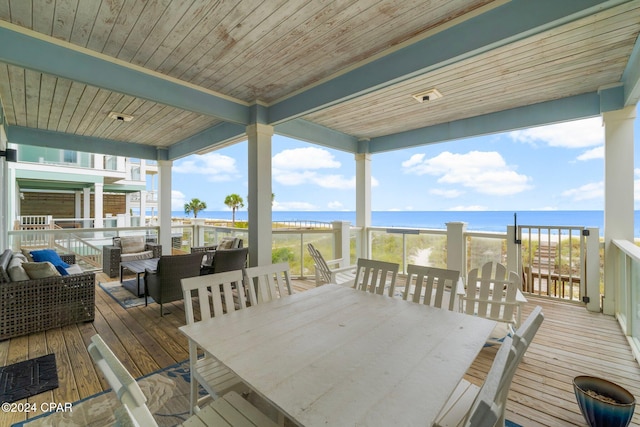 wooden deck with a water view