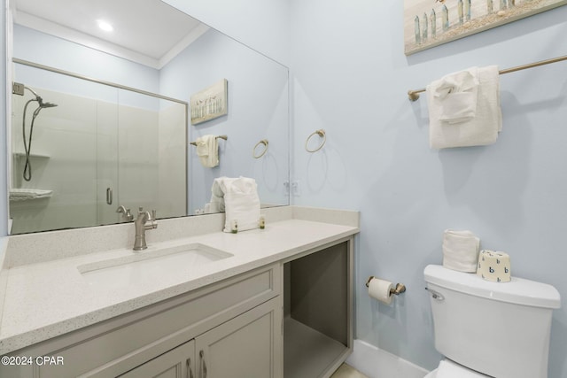 bathroom with vanity, toilet, and walk in shower