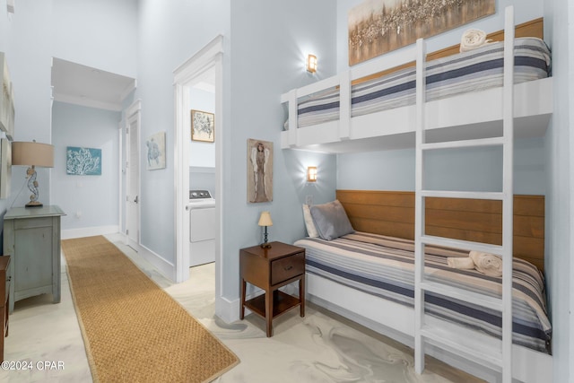 bedroom featuring washer / dryer