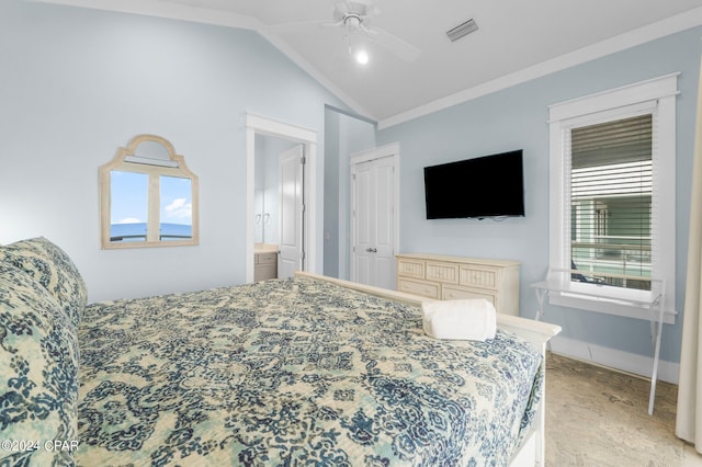 bedroom featuring multiple windows, a closet, lofted ceiling, and ceiling fan