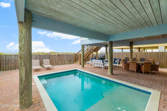 view of pool featuring a patio