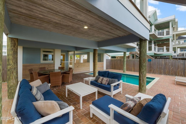 exterior space with a fenced in pool and an outdoor hangout area