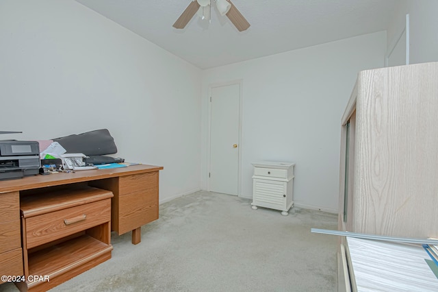 office space with ceiling fan and light colored carpet