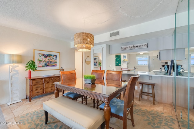 4425 Thomas Dr Unit 707, Panama City, FL 32408 - dining room with light tile patterned floors and a textured ceiling