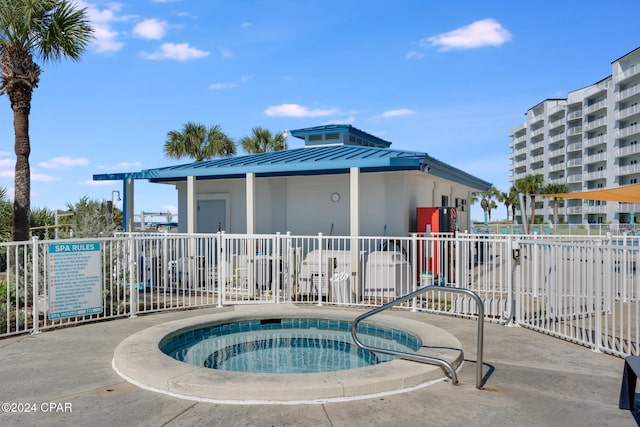 view of pool featuring a hot tub