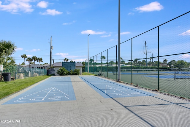 surrounding community with tennis court