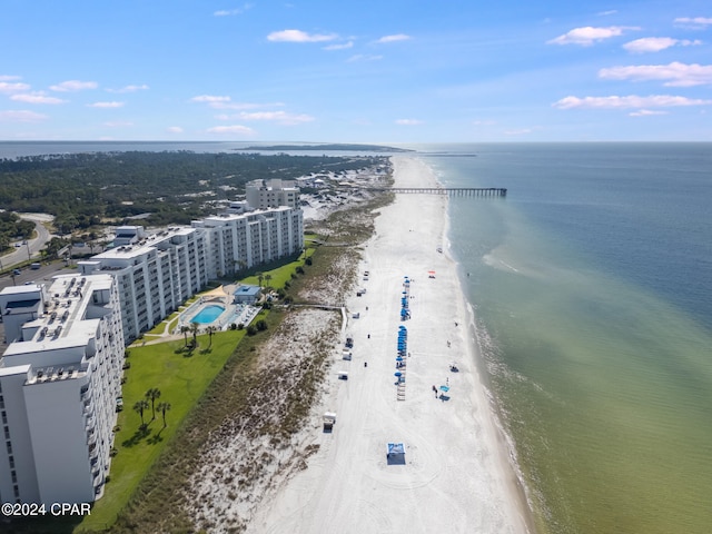 drone / aerial view with a beach view and a water view