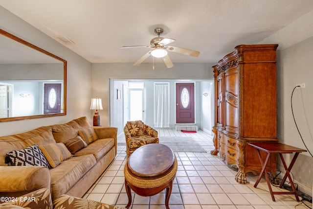 tiled living room featuring ceiling fan