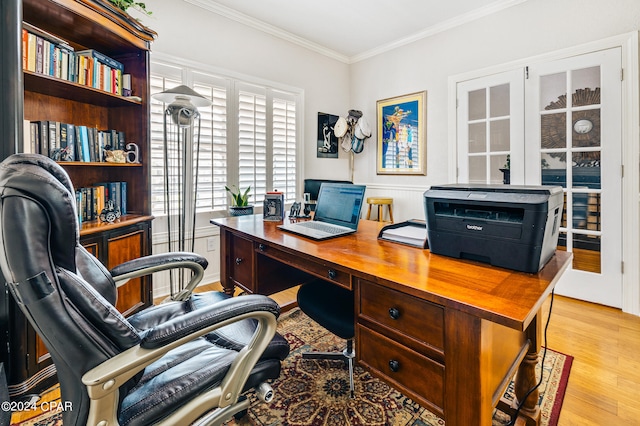 office featuring light wood-type flooring and crown molding