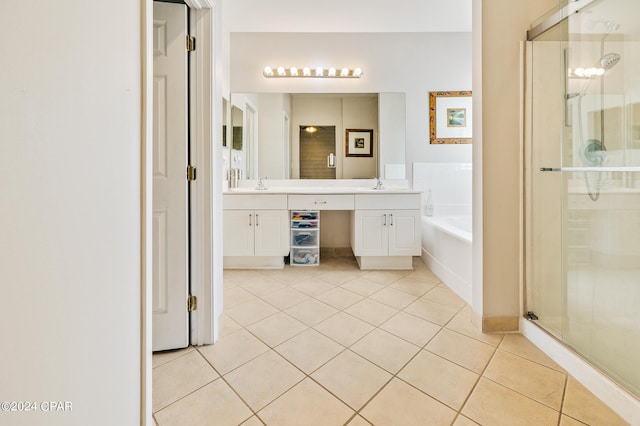 bathroom with vanity, tile patterned floors, and plus walk in shower