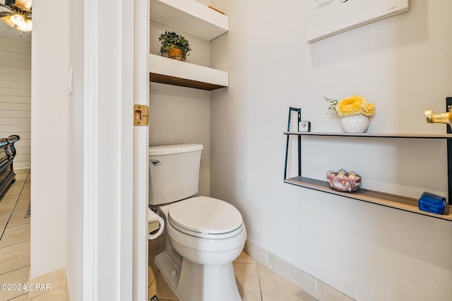 bathroom with toilet and tile patterned floors