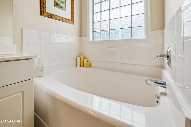 bathroom featuring vanity and a bathtub