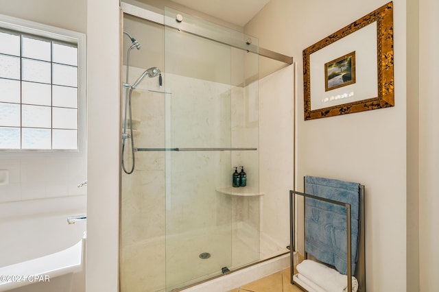 bathroom with tile patterned floors and plus walk in shower