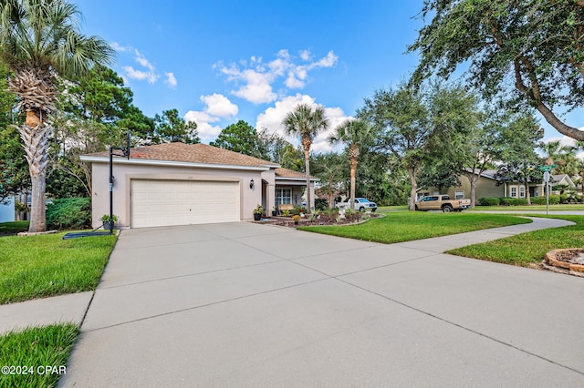 view of front facade with a garage and a front yard