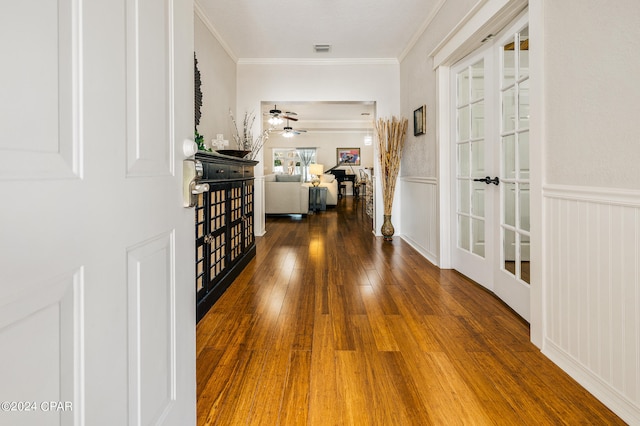 hall featuring ornamental molding and hardwood / wood-style flooring