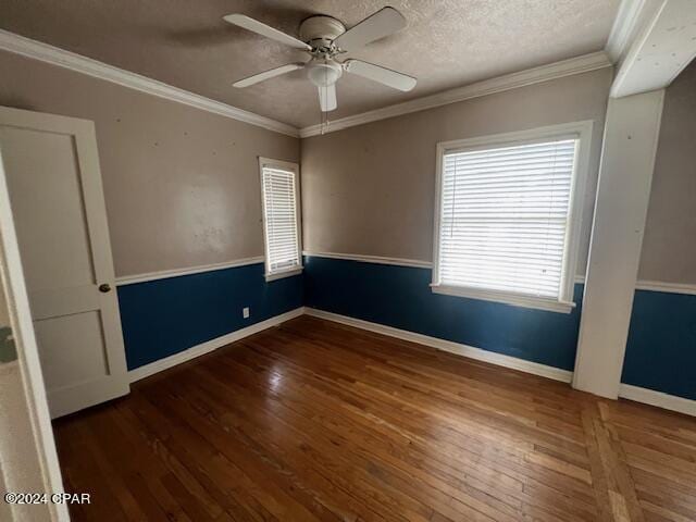 spare room with ceiling fan, dark hardwood / wood-style floors, crown molding, and a textured ceiling