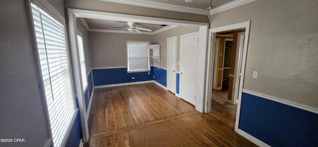 spare room featuring hardwood / wood-style flooring, ceiling fan, and ornamental molding