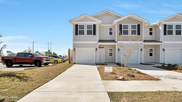 townhome / multi-family property featuring a garage