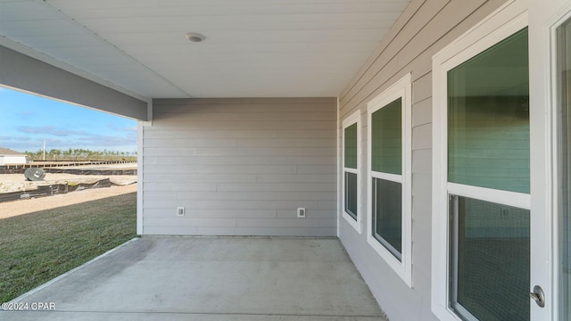 balcony featuring a patio and a sunroom