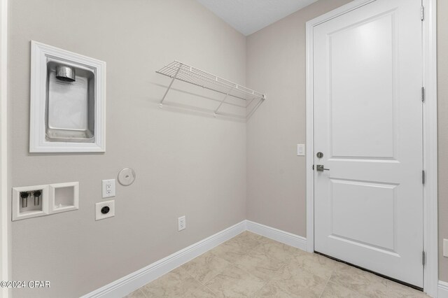 laundry room with washer hookup, hookup for a gas dryer, light tile patterned floors, and electric dryer hookup