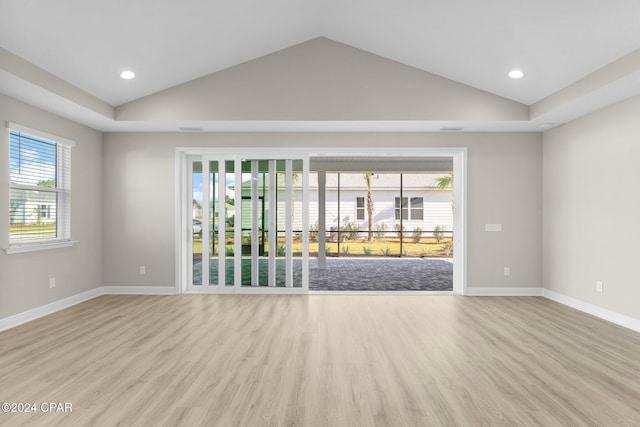 unfurnished room featuring light wood-style floors, recessed lighting, baseboards, and vaulted ceiling