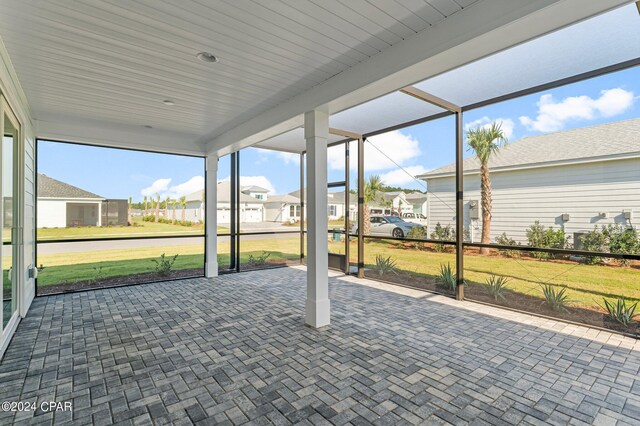 unfurnished sunroom with a residential view