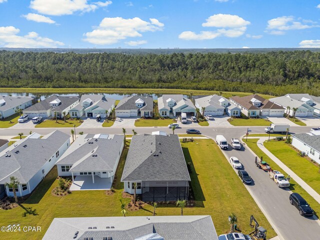 birds eye view of property with a residential view and a forest view