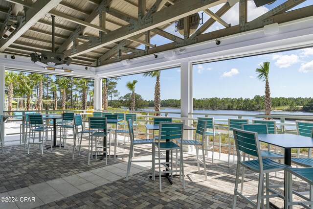 view of patio featuring a water view and a gazebo