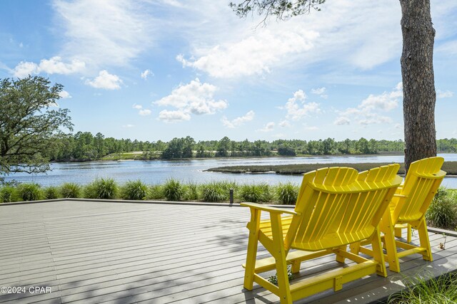 wooden deck featuring a water view