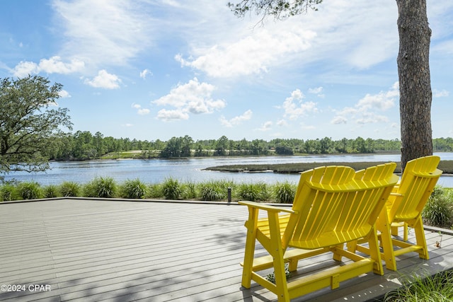 wooden terrace featuring a water view