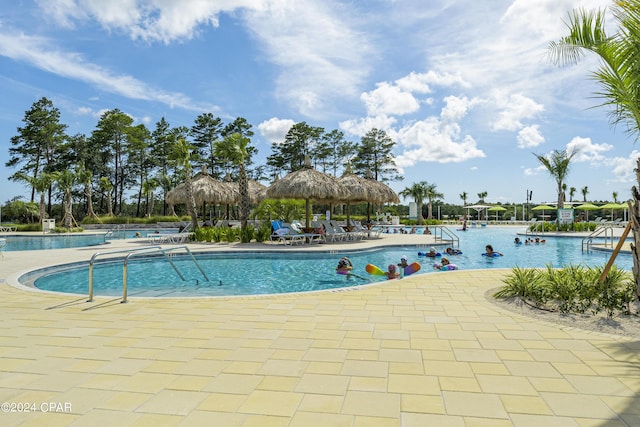 view of swimming pool with a gazebo and a patio