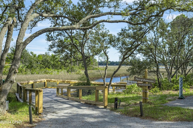 view of home's community with a water view