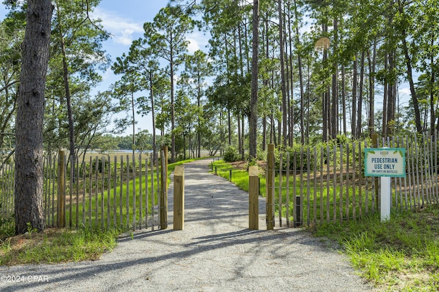 view of gate featuring fence