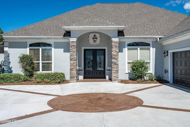 entrance to property featuring french doors