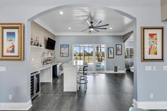 interior space with wooden ceiling, wet bar, wine cooler, and ceiling fan