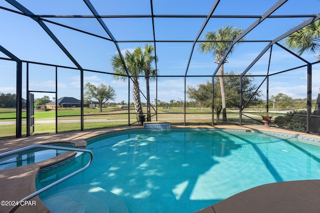 view of swimming pool featuring glass enclosure, a patio area, and a lawn