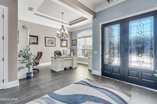 entryway with french doors, a tray ceiling, ornamental molding, and a notable chandelier