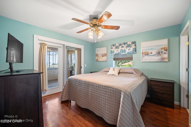 bedroom with access to exterior, multiple windows, dark wood-type flooring, and ceiling fan