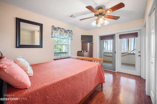 bedroom featuring access to outside, hardwood / wood-style flooring, and ceiling fan